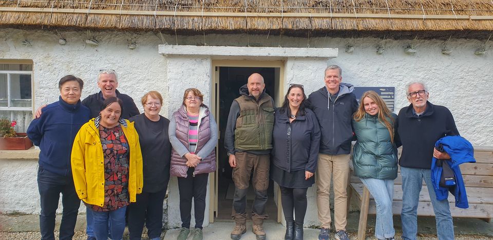 Folk Village staff with In the Land of Saints and Sinners producer Philip Lee (far left), director Robert Lorenz (third from right) and cinematographer Tom Stern (far right)