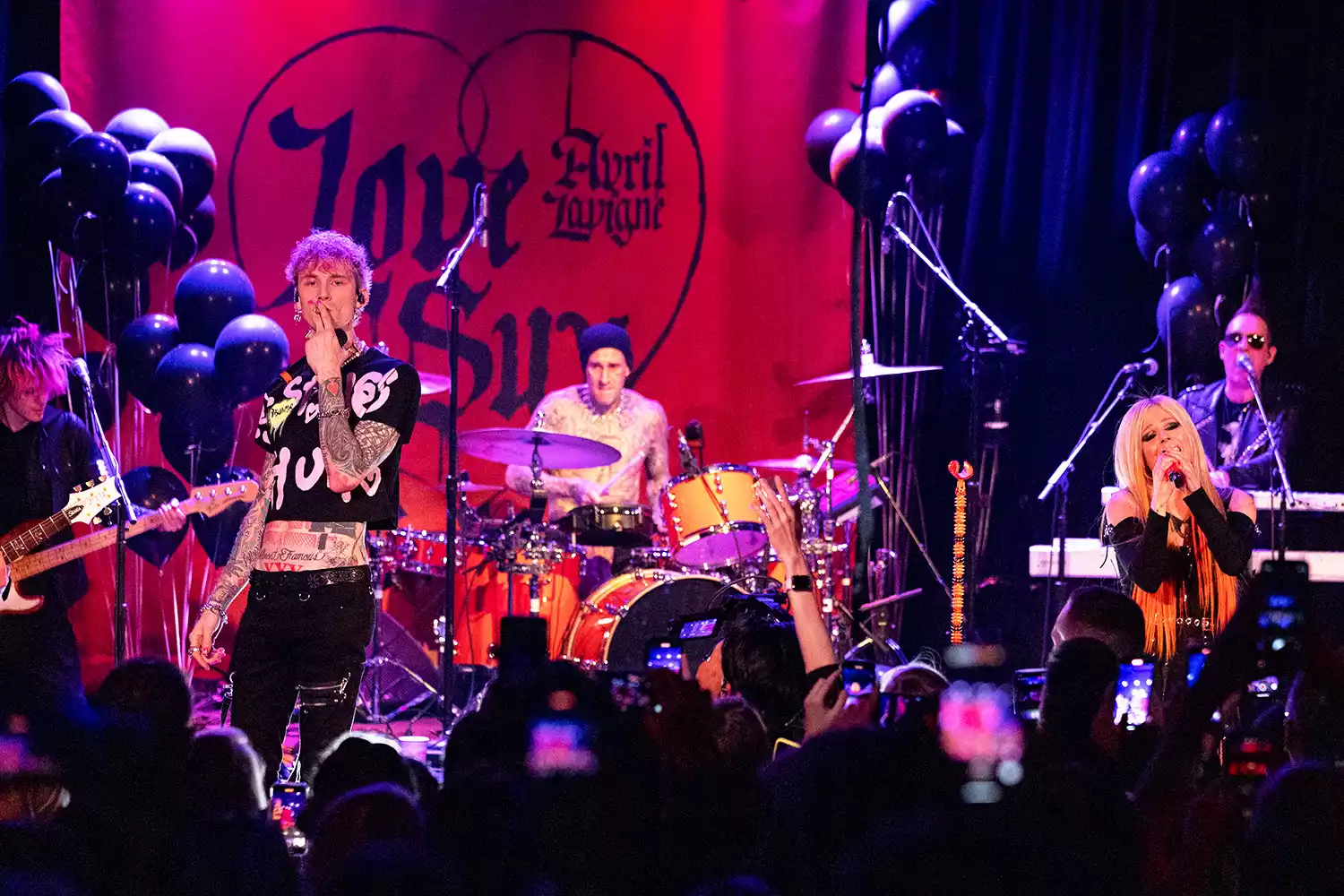 Machine Gun Kelly, Travis Barker and Avril Lavigne perform onstage at 'Avril Lavigne performs live at the Roxy for SiriusXM and Pandora's Small Stage Series' on February 25, 2022 in West Hollywood, California.