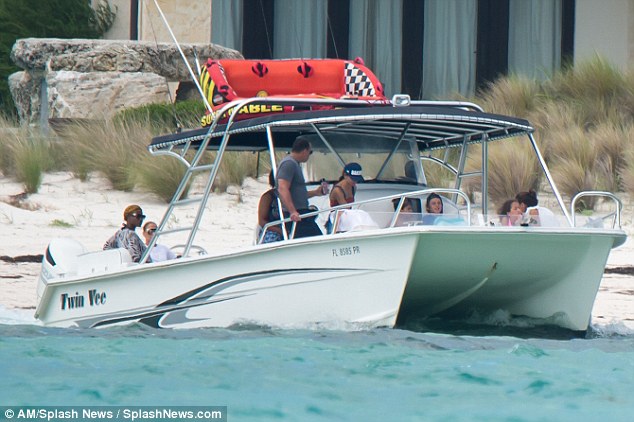 Enjoying the day: They moored at a waterfront restaurant, where they had a drink while they waited for two tables, one for them and one for their kids