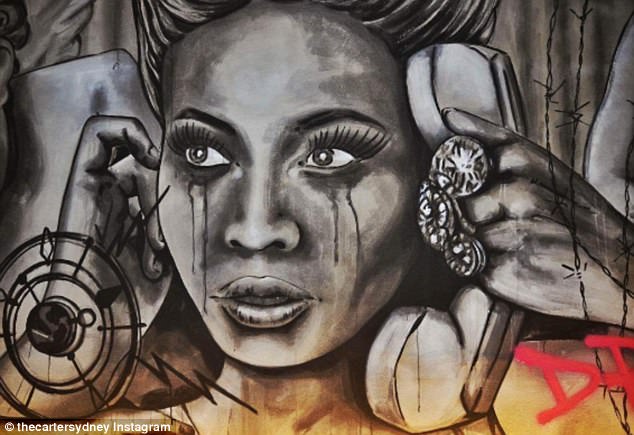 Famous face: A striking image of a teary-eyed Beyoncé adorns one wall, with the title of her 2013 hit 'Drunk In Love' written alongside