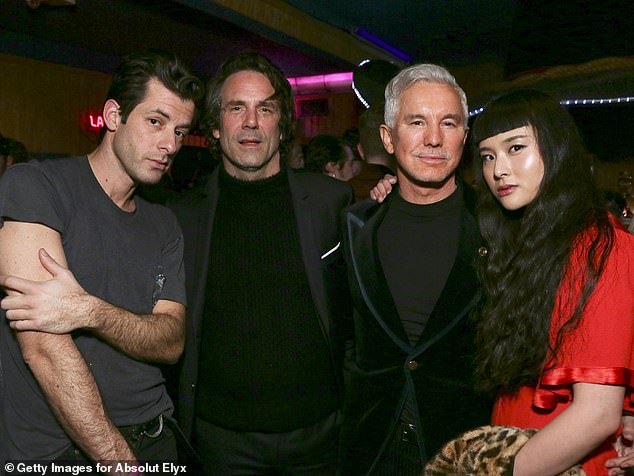 The main man: Mark posed alongside Tom Elmhirst and Baz Luhrmann inside his bash 