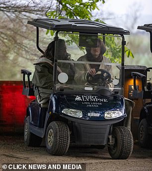 Alison and David couldn't stop smiling while driving around in a golf buggy