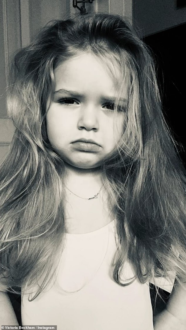 Another black and white snap saw her pouting for the camera as her hair fell in loose waves around her