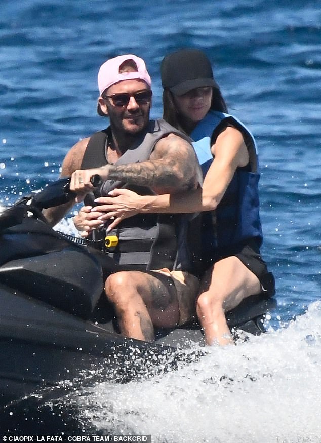 David managed to persuade wife Victoria to jump on a jet ski with him after she squeezed in a workout on the mega yacht