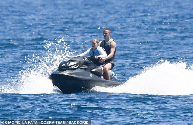 The brood were gathered to celebrate Harper's 13 birthday, with Romeo taking her out on a jet ski ride during the family holiday