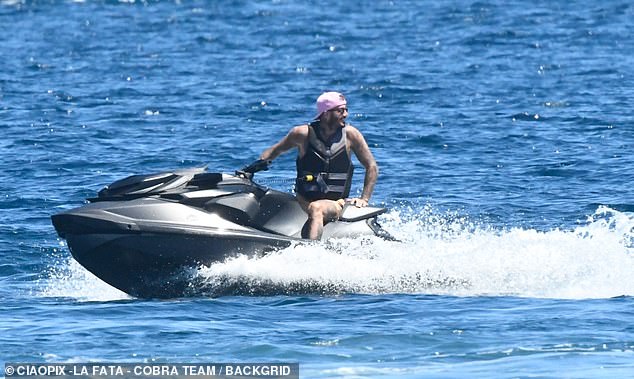 David looked in good spirits as he chilled out on his jet ski and soaked up the sunshine