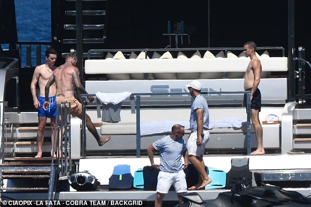 The family were seen chatting away with the crew while their jet skis were prepared