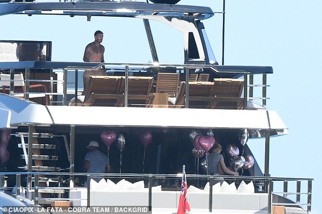 The family celebrated by putting up pink and silver balloons, with Harper pride of place while she enjoyed breakfast with siblings Romeo, 21, and Cruz, 19