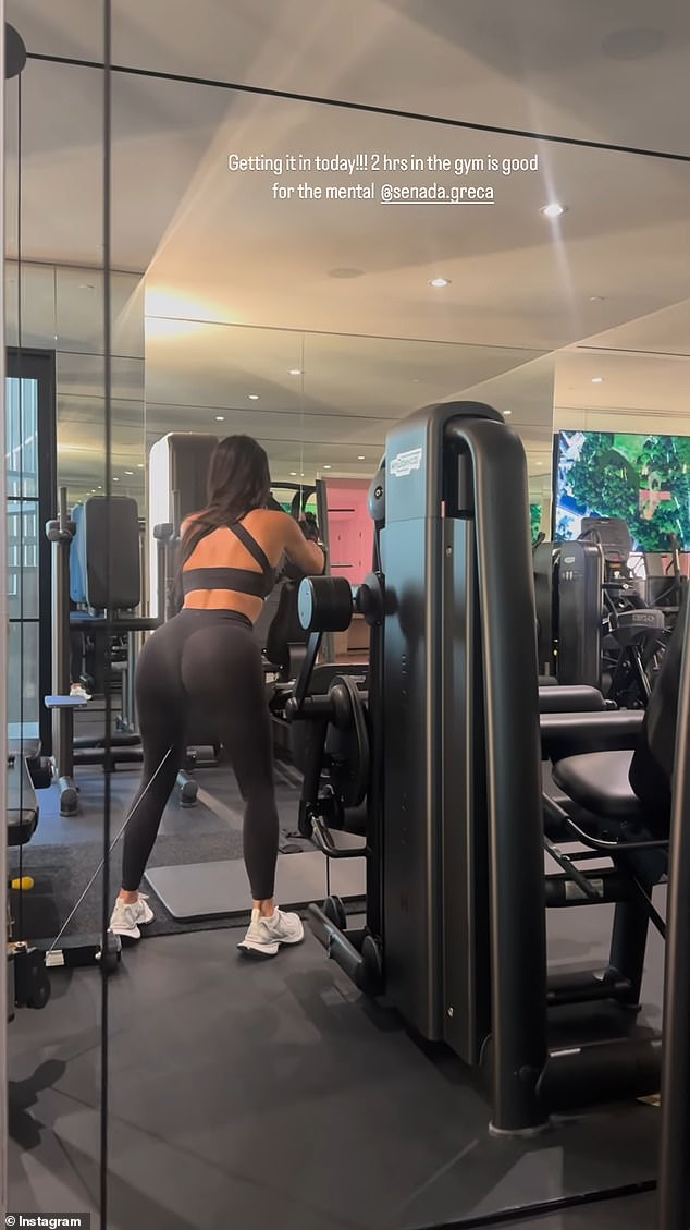 The 43-year-old star wore a sports black sports bra and matching leggings as she faced away from the camera while doing an arm workout