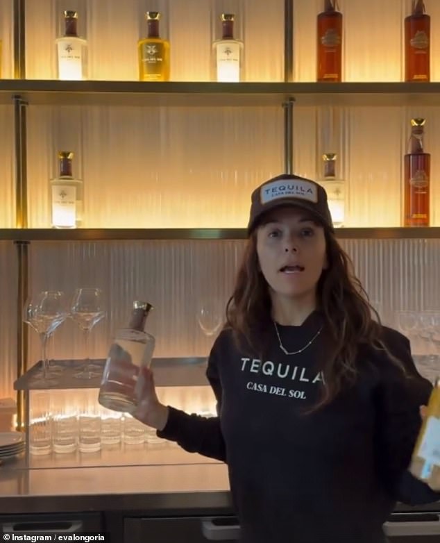 The next clip shows Longoria working behind a bar, stocking shelves at Vogue World, part of Paris Fashion Week.  'I'm the stock girl,' Longoria explained to the camera