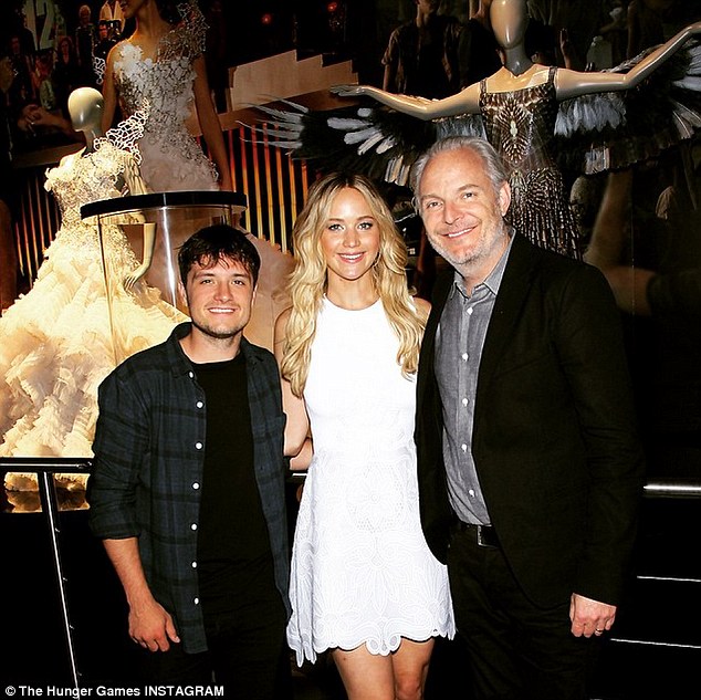 Three musketeers: The Academy Award winning actress posed with Hunger Games director Francis Lawrence and Josh 