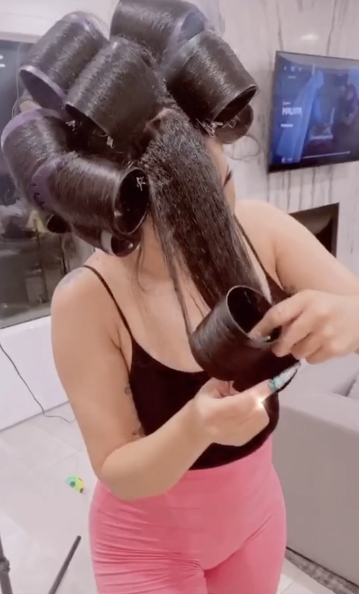 To keep her hair as damaged-free as possible, she recommends using curlers before adding heat directly onto wet hair with a blow dryer