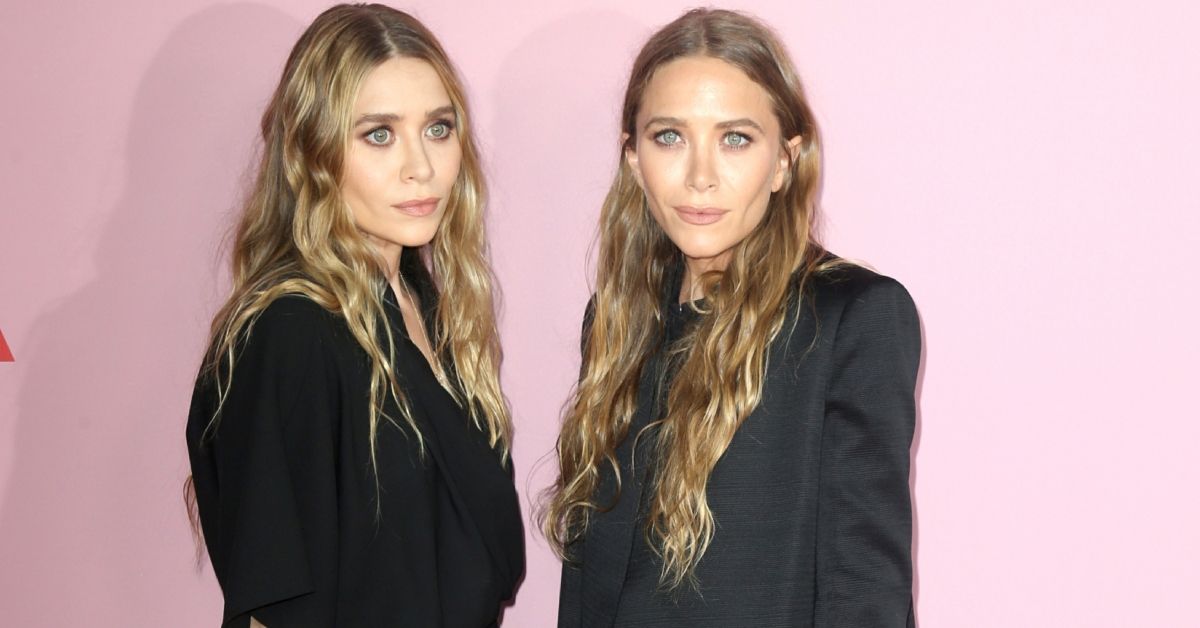 Mary-Kate and Ashley Olsen standing on the red carpet