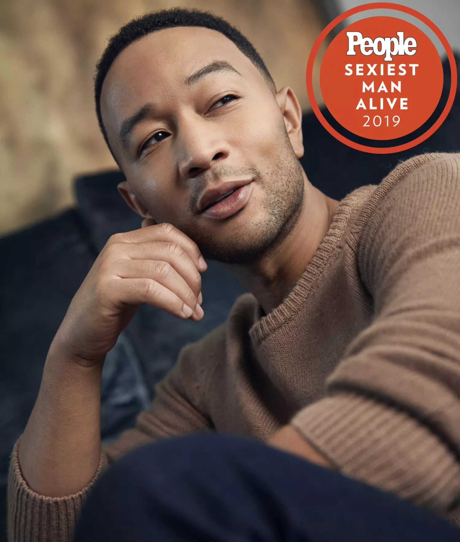 John legend in a tan sweater