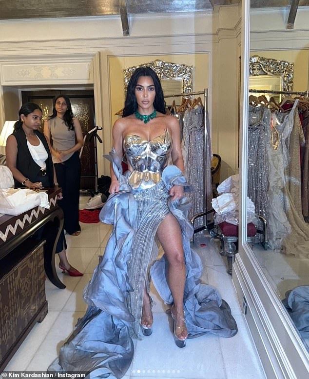 Kim Kardashian wowed in a racy thigh-split corset gown as she shared a slew of glamorous snaps to Instagram on Wednesday from her recent trip to India