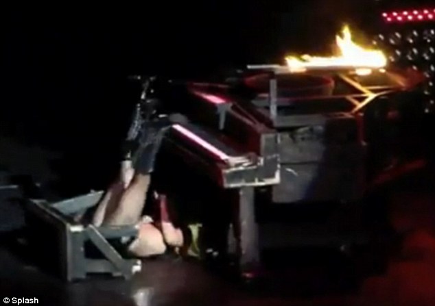 Ouch! Lady Gaga lands flat on her back after falling over piano at live show | Daily Mail Online