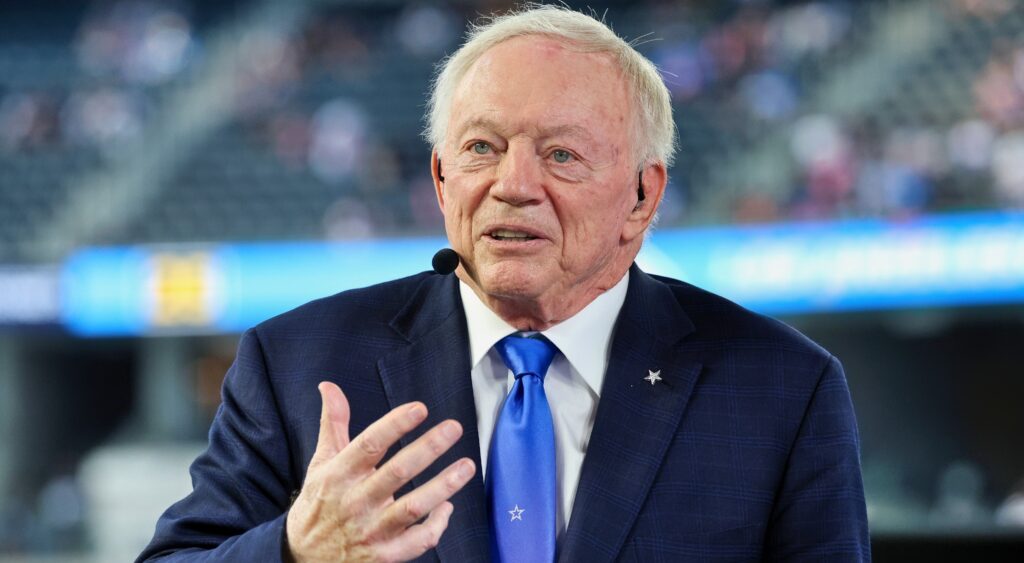 Jerry Jones in suit talking in interview