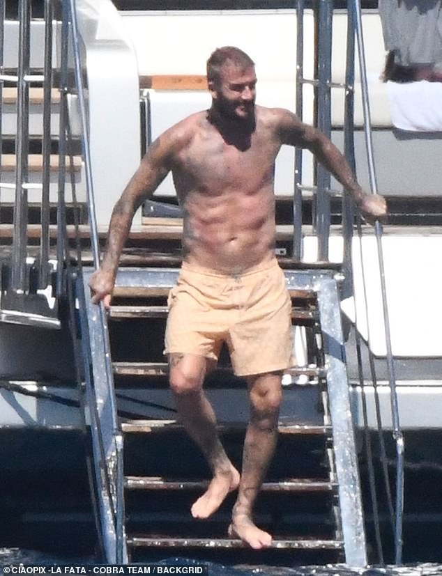 Shirtless David Beckham showed off his six-pack as he holidayed with family on a mega yacht in Sardinia to celebrate Harper's 13th birthday