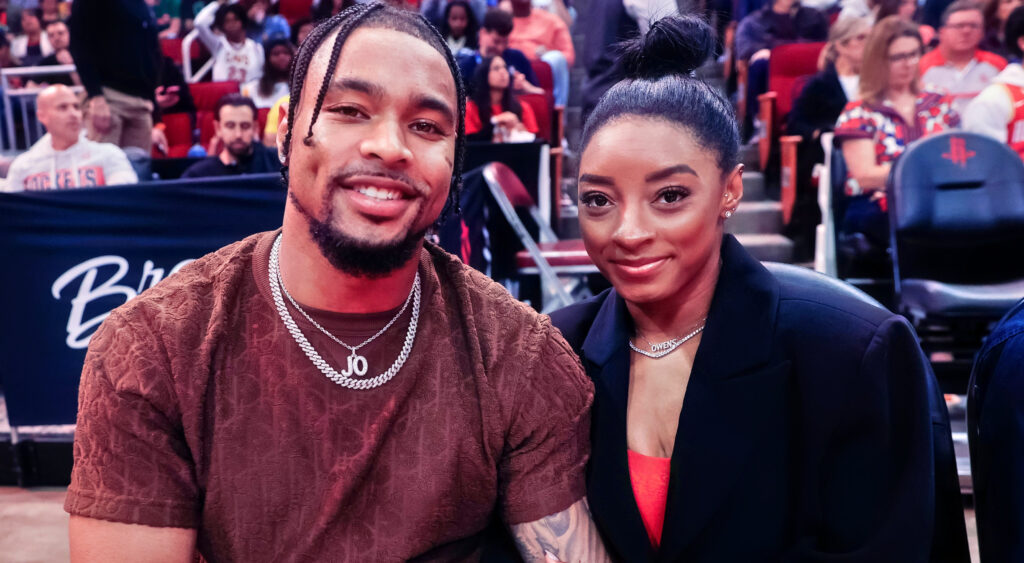 Jonathan Owens sitting next to Simone Biles